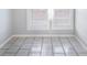 A room with tile flooring and bright natural light at 2317 W Chestnut St, Tampa, FL 33607