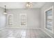 Spacious room with tile flooring and natural light from multiple windows at 2317 W Chestnut St, Tampa, FL 33607