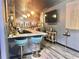 Features a bar area with city skyline mural, seating, lighting, and decor for a unique entertaining space at 2332 Dekan Ln, Land O Lakes, FL 34639