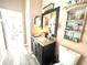 Elegant bathroom with granite countertops, a decorative mirror, and plenty of storage space at 2332 Dekan Ln, Land O Lakes, FL 34639