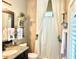 Charming bathroom with granite countertops, decorative shelves, and stylish fixtures at 2332 Dekan Ln, Land O Lakes, FL 34639