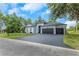 Charming single-story home with a well-manicured lawn and a three-car garage at 2332 Dekan Ln, Land O Lakes, FL 34639