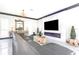 Spacious living room with a sleek marble fireplace, plush seating, and modern decor at 2332 Dekan Ln, Land O Lakes, FL 34639