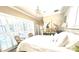 Serene main bedroom featuring shuttered windows, a decorative display, and a comfortable bed at 2332 Dekan Ln, Land O Lakes, FL 34639