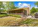 Beautiful backyard featuring a screened patio and a stone patio with table and chairs at 24076 Ragan Dr, Brooksville, FL 34601
