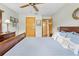 Cozy bedroom with wood floors, wood furniture, and a view of the doorway to the rest of the home at 24076 Ragan Dr, Brooksville, FL 34601