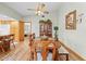 Inviting dining room with a wood table, matching chairs, ceiling fan, and a view into the kitchen at 24076 Ragan Dr, Brooksville, FL 34601