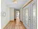 Inviting entryway featuring wood-look floors and a decorative front door with leaded glass at 24076 Ragan Dr, Brooksville, FL 34601
