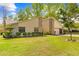 Charming home boasting stone accents, a well-manicured lawn, and a spacious driveway at 24076 Ragan Dr, Brooksville, FL 34601