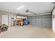 Spacious two-car garage with storage, workspace, and a functional overhead door at 24076 Ragan Dr, Brooksville, FL 34601