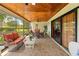 Spacious screened-in porch with wicker furniture, offering a relaxing outdoor living space at 24076 Ragan Dr, Brooksville, FL 34601