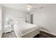 Bright bedroom with a comfortable bed, neutral tones, and modern wood-look flooring at 2554 Brimhollow Dr, Valrico, FL 33596