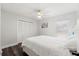 Light bedroom featuring a comfortable bed, wood-look floors, and a spacious closet at 2554 Brimhollow Dr, Valrico, FL 33596