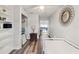 Inviting bedroom with wood-look floors, built-in bookshelves, and a cozy twin bed at 2554 Brimhollow Dr, Valrico, FL 33596