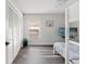 Clean bedroom featuring neutral paint, wood-look flooring, and a comfortable bunk bed at 2554 Brimhollow Dr, Valrico, FL 33596