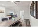 Bright dining room features a modern ceiling fan, wood-look floors, and an adjacent view to the living area at 2554 Brimhollow Dr, Valrico, FL 33596
