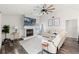 Bright living room featuring vaulted ceilings, a modern fireplace, and sleek, dark hardwood flooring at 2554 Brimhollow Dr, Valrico, FL 33596