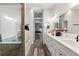 Gorgeous primary bathroom features dual sinks, marble counters, and a glass-enclosed shower at 2554 Brimhollow Dr, Valrico, FL 33596