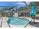Lovely screened-in pool featuring crystal clear water and an attached patio area at 2554 Brimhollow Dr, Valrico, FL 33596
