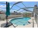 A screened-in pool with clear blue water and a patio, ready for entertaining and relaxing at 2554 Brimhollow Dr, Valrico, FL 33596
