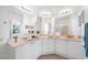 Bright bathroom with double sinks, ample counter space, and modern fixtures at 2773 Via Cipriani # 1322A, Clearwater, FL 33764