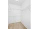 Walk-in closet with multiple wire shelves for efficient storage solutions at 2773 Via Cipriani # 1322A, Clearwater, FL 33764