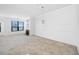 Spacious living room, offering a fireplace, a water view, and carpet floors at 2773 Via Cipriani # 1322A, Clearwater, FL 33764