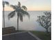Stunning water view featuring a bridge and palm trees against a tranquil scene at 2773 Via Cipriani # 1322A, Clearwater, FL 33764