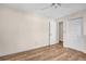 Spacious bedroom with wood-look flooring, two closets, and ample natural light at 2814 Lomond Dr, Palm Harbor, FL 34684