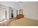 Bedroom features a walk-in closet, hardwood floors, ceiling fan, and a wicker dresser at 2814 Lomond Dr, Palm Harbor, FL 34684