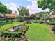 Landscaped clubhouse grounds for the Highland Lakes active adult community at 2814 Lomond Dr, Palm Harbor, FL 34684