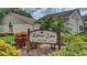 Elegant Highland Lakes Golf Club sign amidst vibrant greenery, showcasing the community's golf amenities at 2814 Lomond Dr, Palm Harbor, FL 34684
