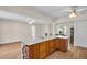 Spacious kitchen with light countertops, wooden cabinets, and an open layout to the dining and living area at 2814 Lomond Dr, Palm Harbor, FL 34684