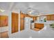 Well-lit kitchen featuring wooden cabinets, white countertops, stainless steel appliances and ceiling fans at 2814 Lomond Dr, Palm Harbor, FL 34684