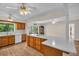 Bright kitchen with wooden cabinets, light countertops, and open layout to the living area at 2814 Lomond Dr, Palm Harbor, FL 34684