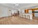 Open living and kitchen area with island seating and plenty of space for dining at 2814 Lomond Dr, Palm Harbor, FL 34684