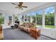Bright sunroom with large windows and comfortable seating at 2814 Lomond Dr, Palm Harbor, FL 34684