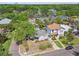 An aerial view of the property showcasing its roof, landscaping, and tree coverage at 2815 W Estrella St, Tampa, FL 33629