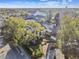 Aerial shot displays neighborhood homes near tennis facilities with lush greenery and mature trees at 2815 W Estrella St, Tampa, FL 33629