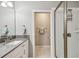 Clean bathroom featuring a single sink, modern fixtures, and a glass-enclosed shower at 2815 W Estrella St, Tampa, FL 33629