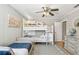 Shared bedroom with a bunk bed, ceiling fan, and hardwood floors at 2815 W Estrella St, Tampa, FL 33629
