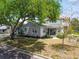 Charming exterior of the two-story home features mature trees and a well-maintained lawn at 2815 W Estrella St, Tampa, FL 33629