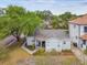 Exterior of the well-maintained home features a cozy front porch and manicured landscaping at 2815 W Estrella St, Tampa, FL 33629
