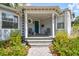 Inviting front porch with neutral colors and a cozy seating area at 2815 W Estrella St, Tampa, FL 33629