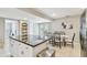 Bright kitchen with granite countertops and an island that is connected to the dining area at 2815 W Estrella St, Tampa, FL 33629