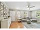 Bright living room with hardwood floors, large windows, and a comfortable seating arrangement at 2815 W Estrella St, Tampa, FL 33629