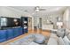 Cozy living room with hardwood floors, paneled walls, and abundant natural light at 2815 W Estrella St, Tampa, FL 33629