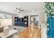 Cozy living room featuring hardwood floors, paneled walls, and abundant natural light at 2815 W Estrella St, Tampa, FL 33629