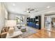 Cozy living room with natural light, ceiling fan, and stylish furnishings at 2815 W Estrella St, Tampa, FL 33629