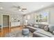 Bright living room with hardwood floors, large windows, and a comfortable seating arrangement at 2815 W Estrella St, Tampa, FL 33629